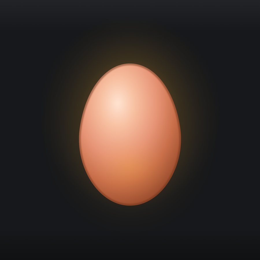 An uncut egg in warm red gold.